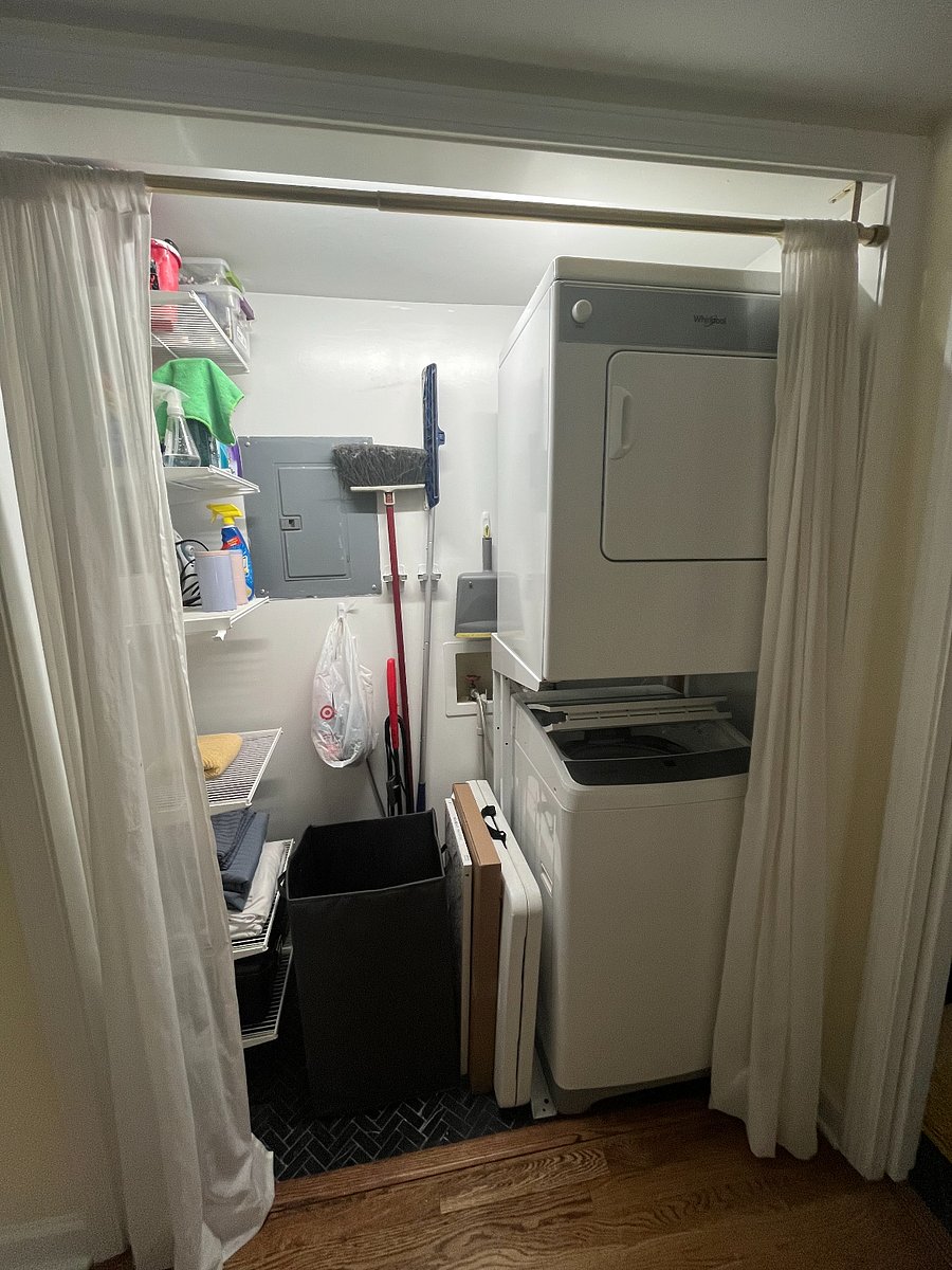 Hall closet with washer / dryer