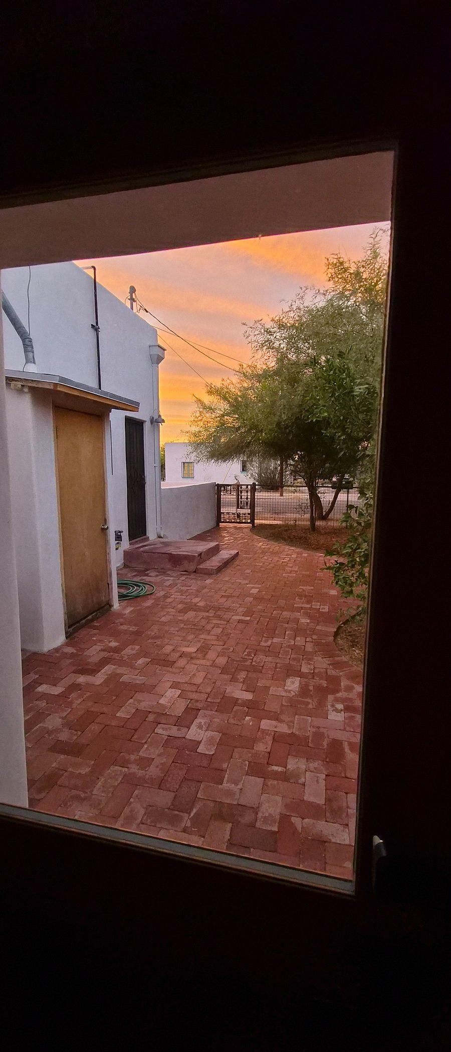 view of patio toward entry gate