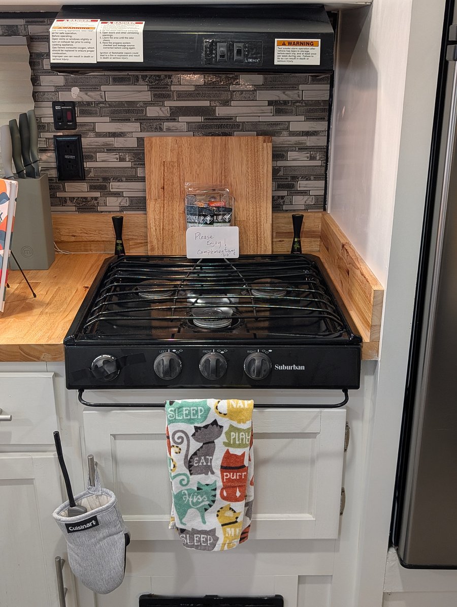 If you enjoy cooking, the RV features a convenient gas stove with three burners, a cooking fan, and a light to make meal preparation easy and comfortable.