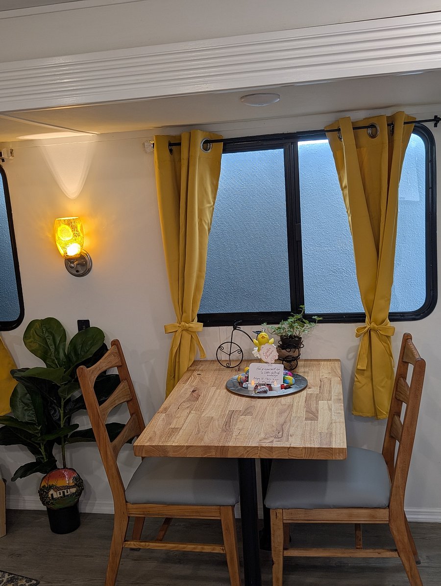 The RV features a charming dining nook for two, perfect for enjoying meals, morning coffee, or planning the days adventures. We provide dishes, glassware, and silverware so you have everything you need for a comfortable stay. 