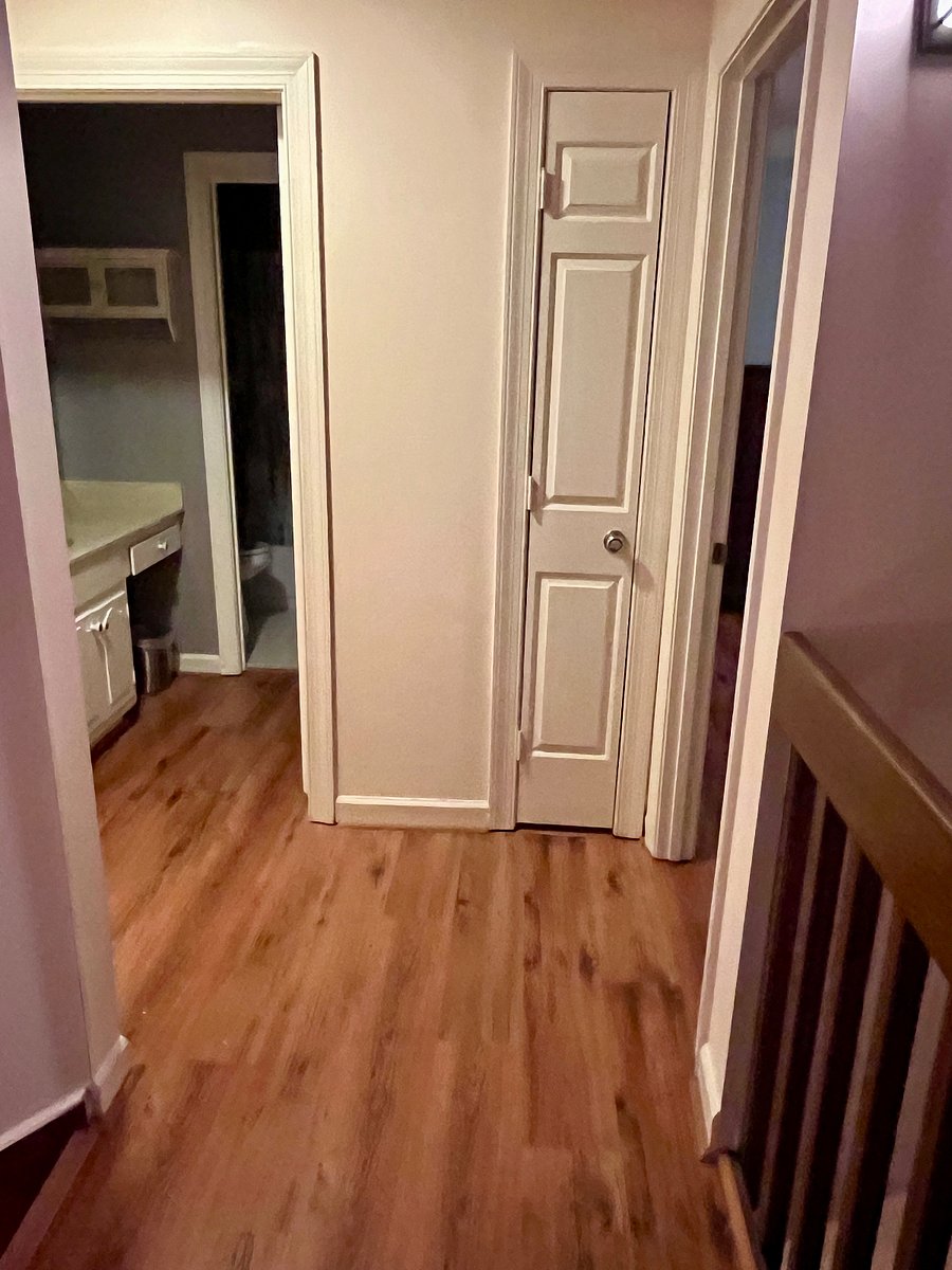 Hallway upstairs to bathroom and bedroom.