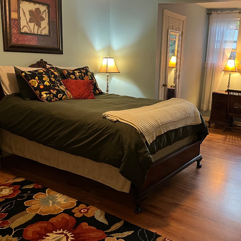 Spacious bedroom with queen sized bed on second floor.