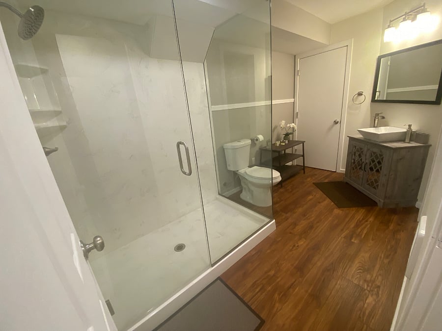 Bathroom with Oversized Marble Slab Glass Shower