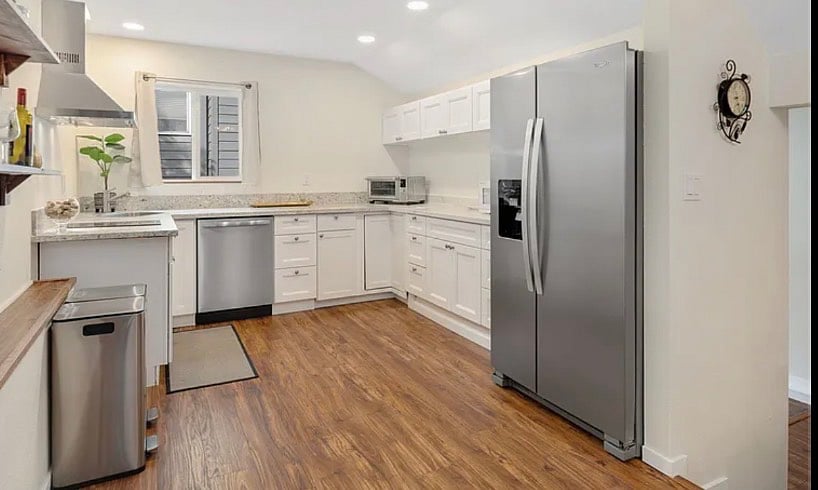Kitchen with Dishwasher, Induction Stovetop, granite and marble counters and countertop oven