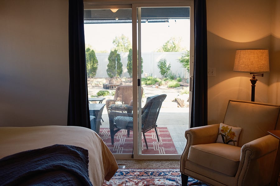Private backyard access from the king suite with blackout curtains