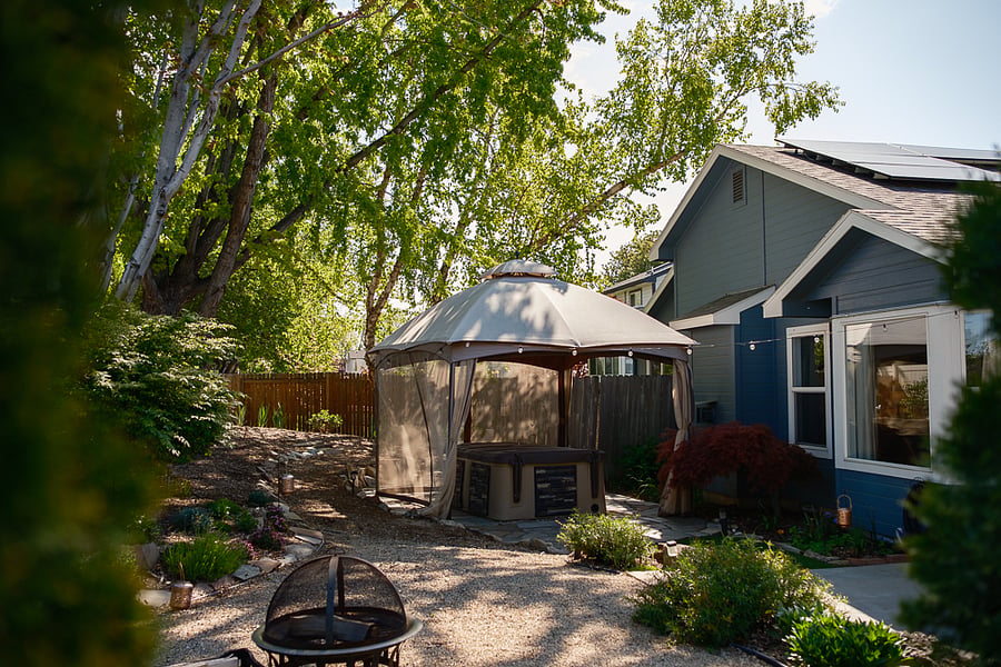 Shared backyard space with patio, hot tub and firepit