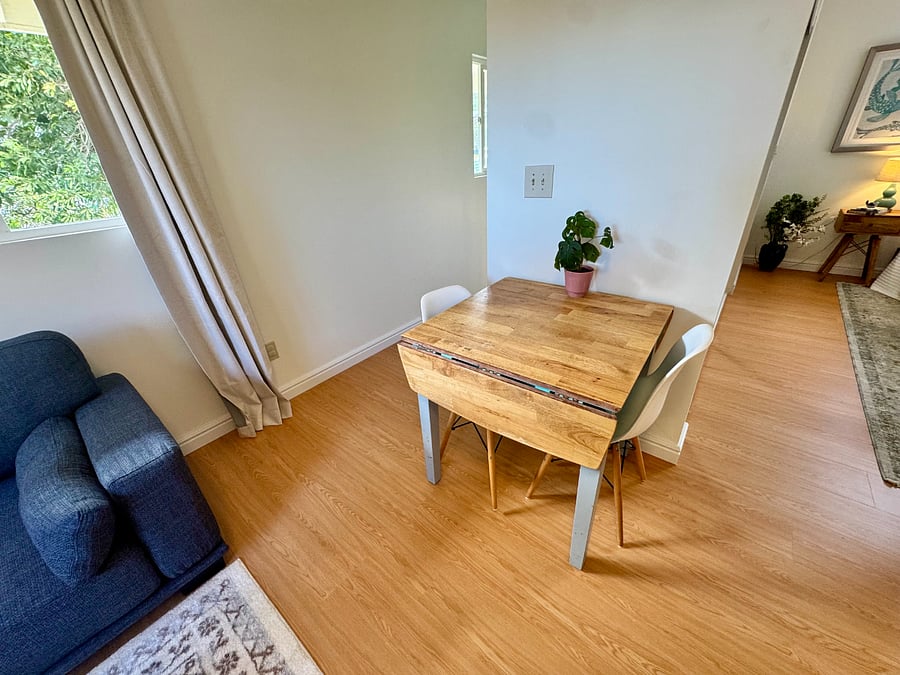 Drop-leaf dining table seats two daily, opens up when you have a guest over.