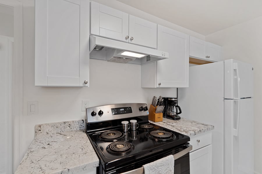 Electric energy saving stove and oven with full sized refrigerator and freezer. 