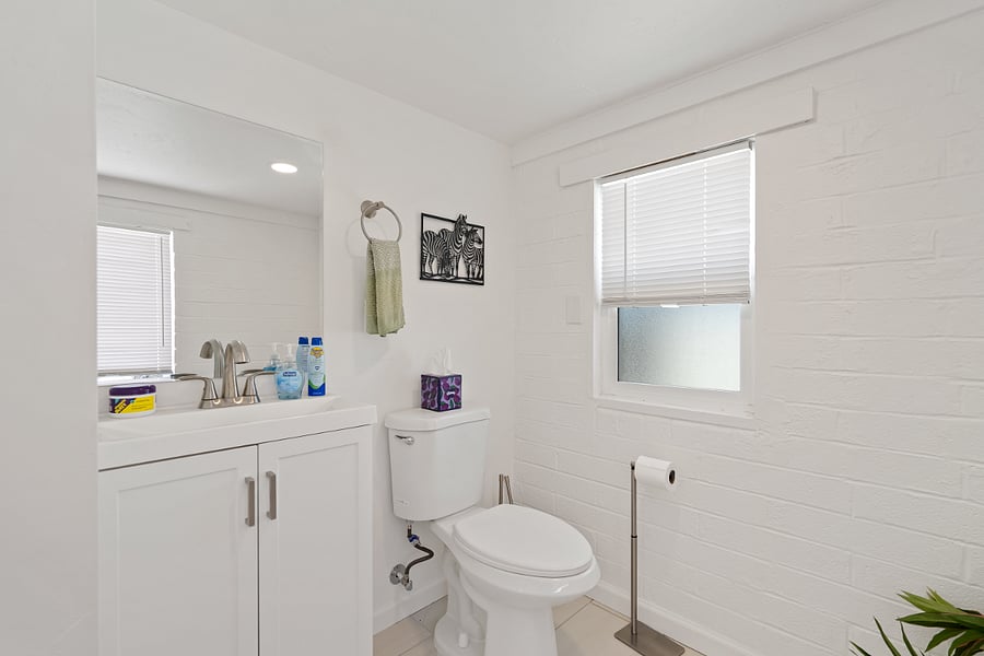 Large Half bath in private area off laundry room. 