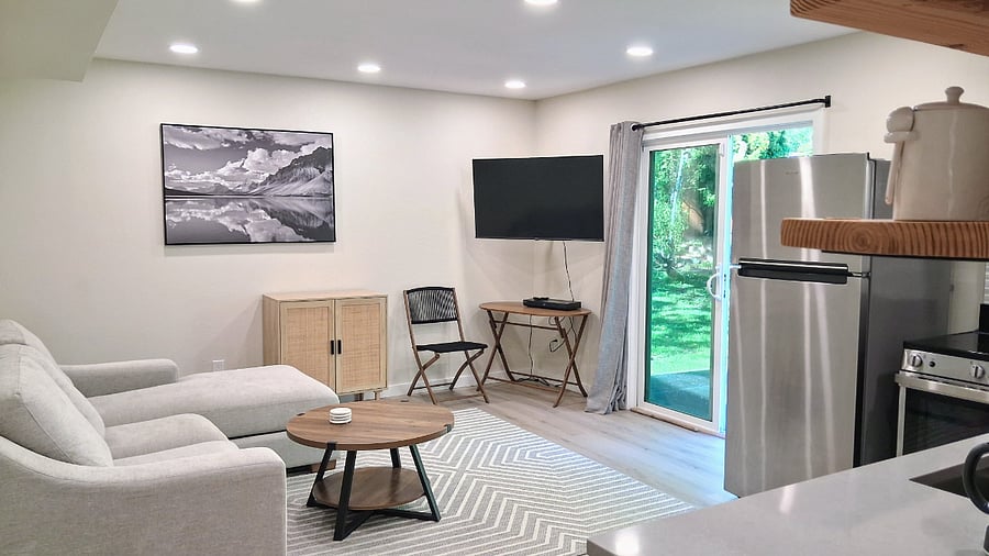 living room with sliding door to outdoor backyard patio
