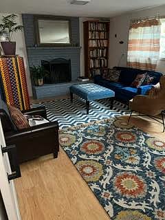 Living room with former tenant's furniture