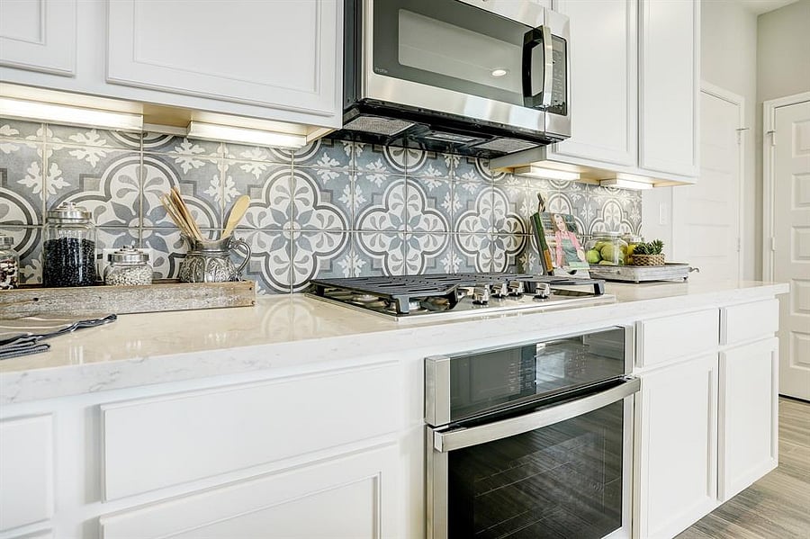The open, fully equipped kitchen offers plenty of space to cook and gather, seamlessly connecting to the homes living areas.