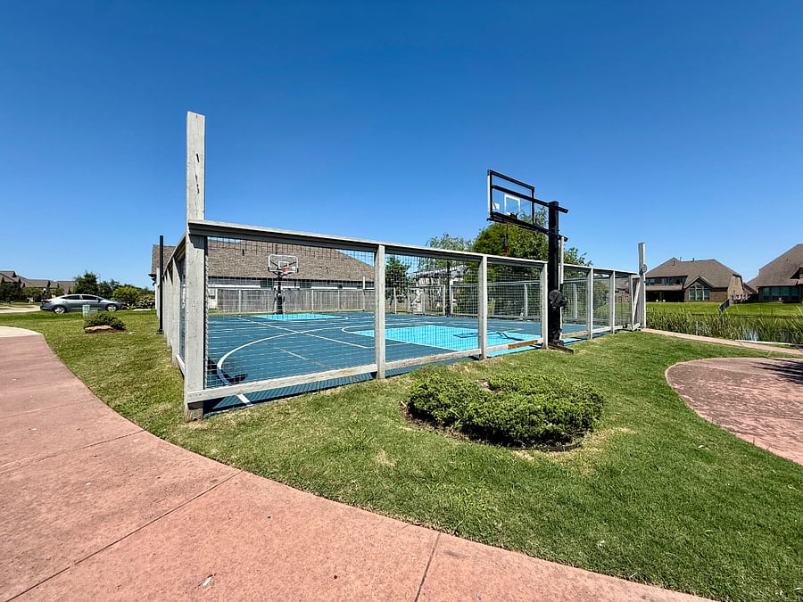 The community basketball court offers a convenient space to stay active and enjoy outdoor recreation. The basketball court is about a minute walk from the house.
