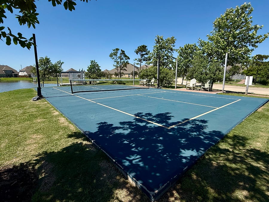 Enjoy the pickleball court set beside the water, complete with Adirondack chairs nearby picnic tables for relaxing between games. The pickleball court is under a minute walk from the house.