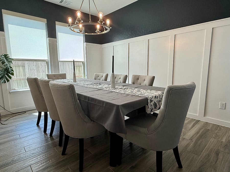 The formal dining room provides a welcoming setting for shared meals, whether everyday dining or special occasions.