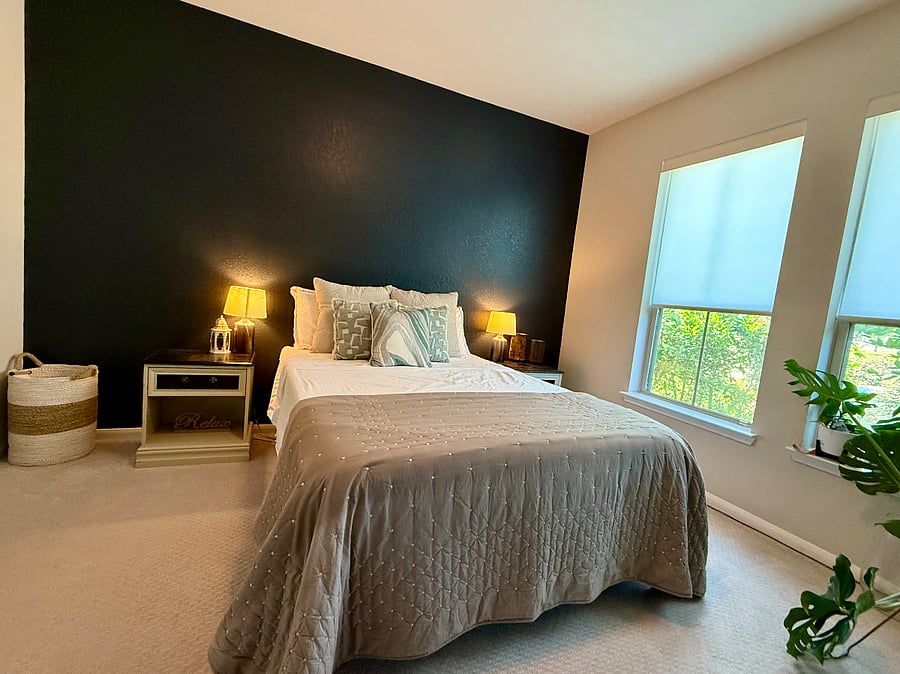 A secondary bedroom on the main floor features a full bathroomideal for guests seeking comfort and easy accessibility.