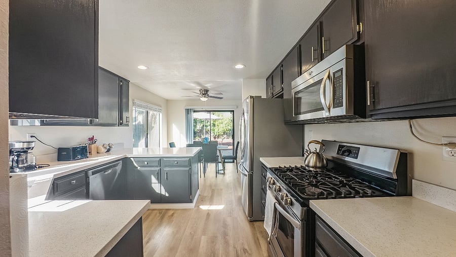 Kitchen with dishwasher, microwave, stove, oven and refrigerator