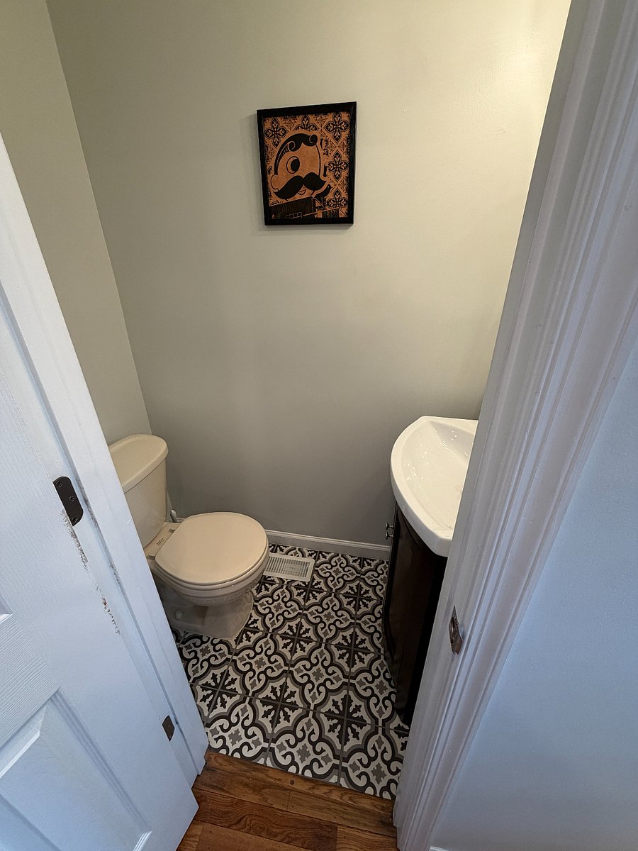 Small bathroom off the kitchen and near back entrance. 