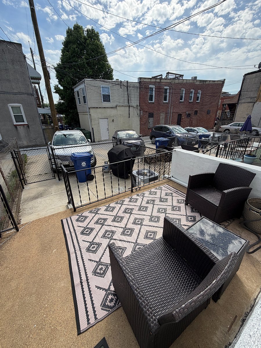 Parking area is large enough for any car/SUV. patio furniture and grill included. 