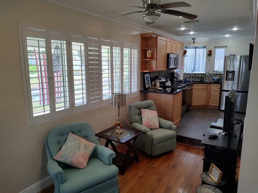apt #1 tv room + kitchen view 071222026