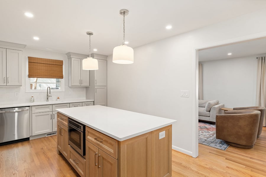 The gorgeous kitchen opens up to the living room area for easy living and entertaining