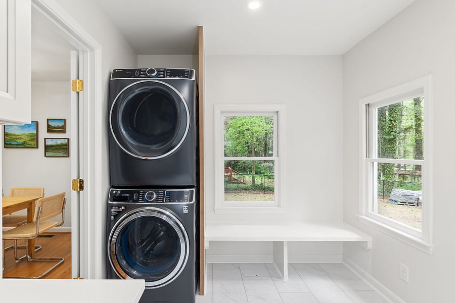 The large laundry and mudroom off the kitchen and back of the house features a brand new washer and dryer and tons of storage.