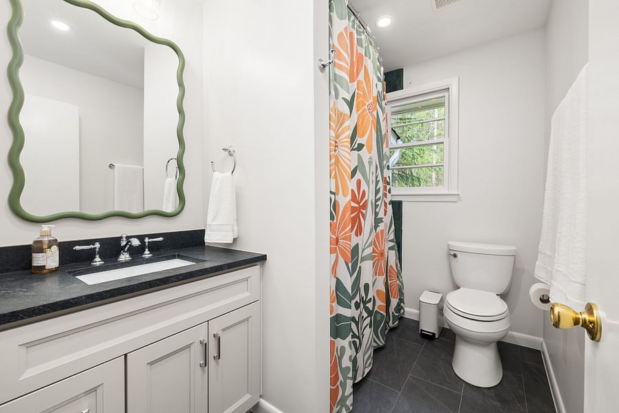 Full hall bath with bold colors and fun design features