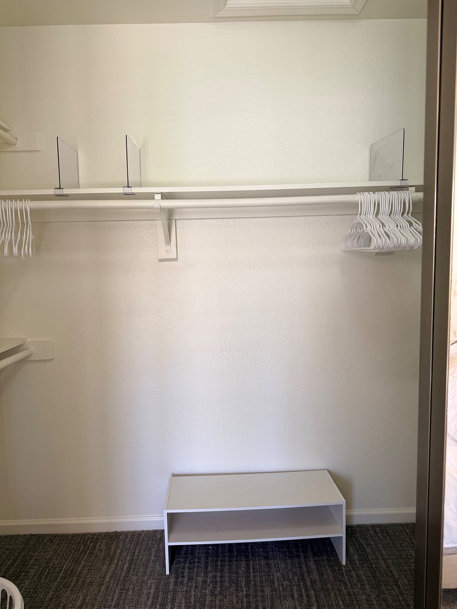 Master walk in closet with plenty of hanging storage