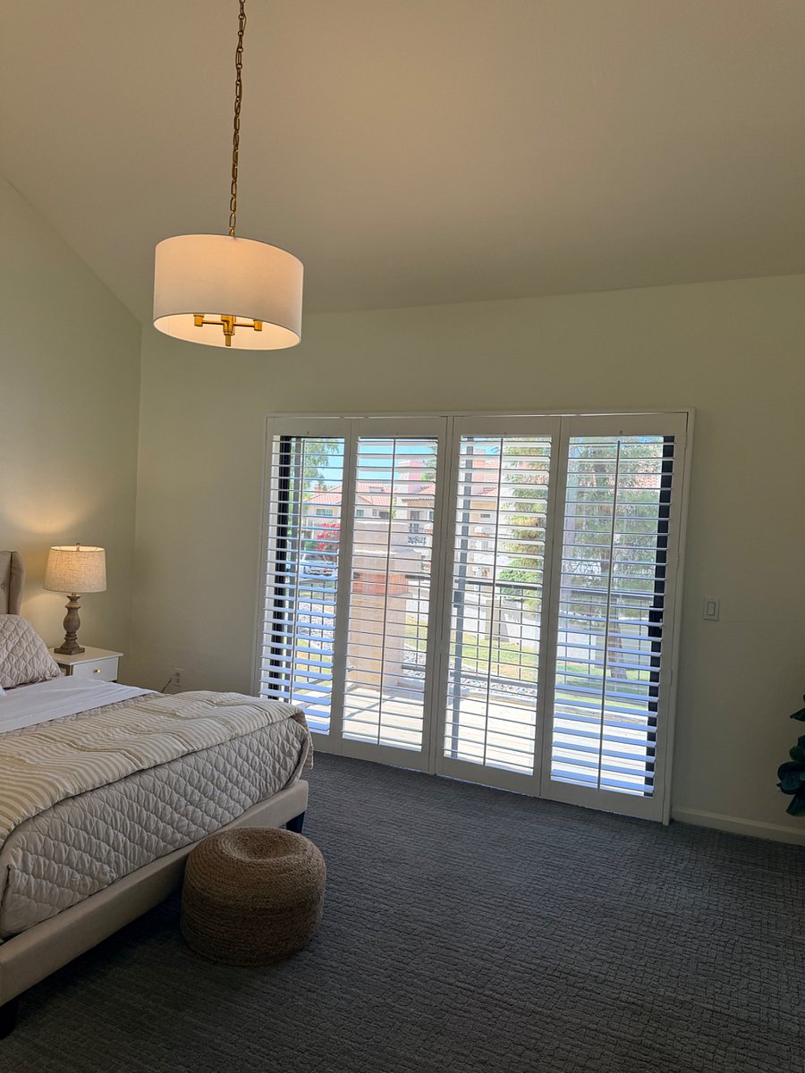 Primary bedroom with balcony