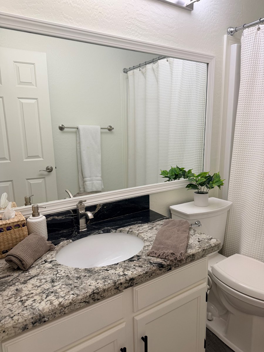 Secondary bathroom with bathtub and shower