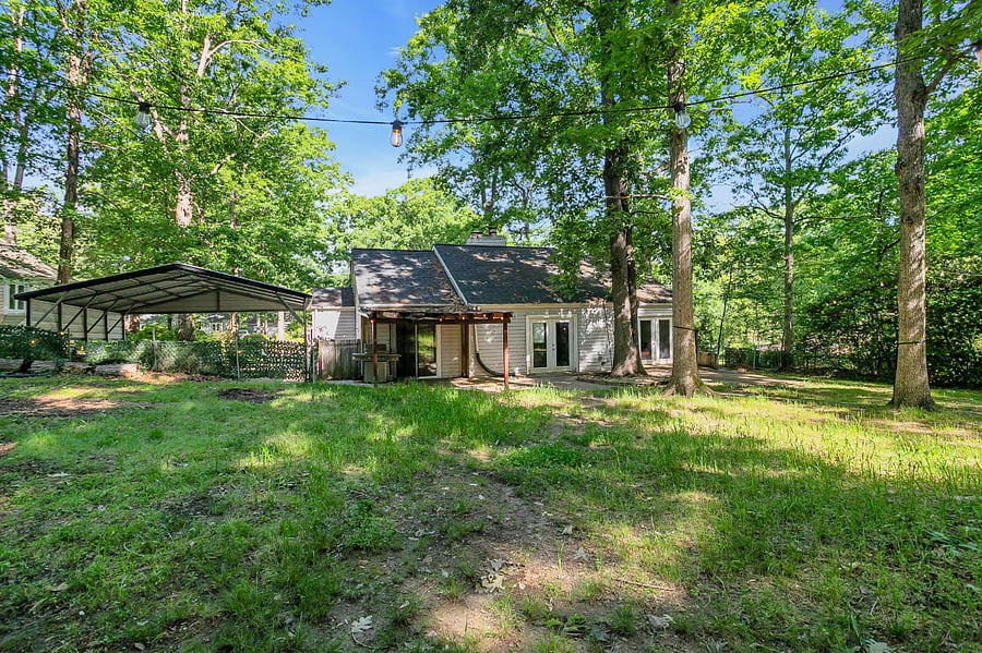 Fully fenced backyard with fire pit