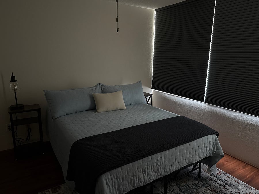 Nightstands with charging stations for added convenience. Blackout window blinds for added comfort.