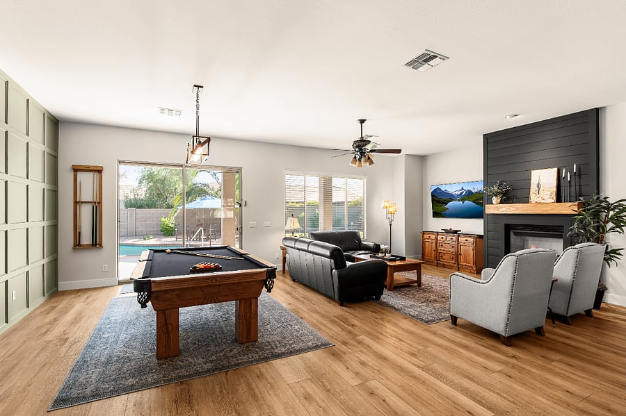 Spacious family room featuring a stunning high-end pool table - perfect for game nights.
