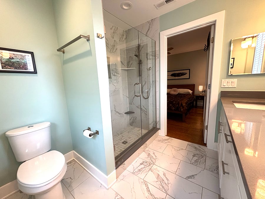 Primary bathroom with double sinks and walk-in shower