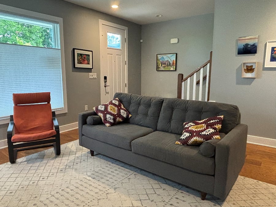 Living room with comfy couch, tv and gas fireplace