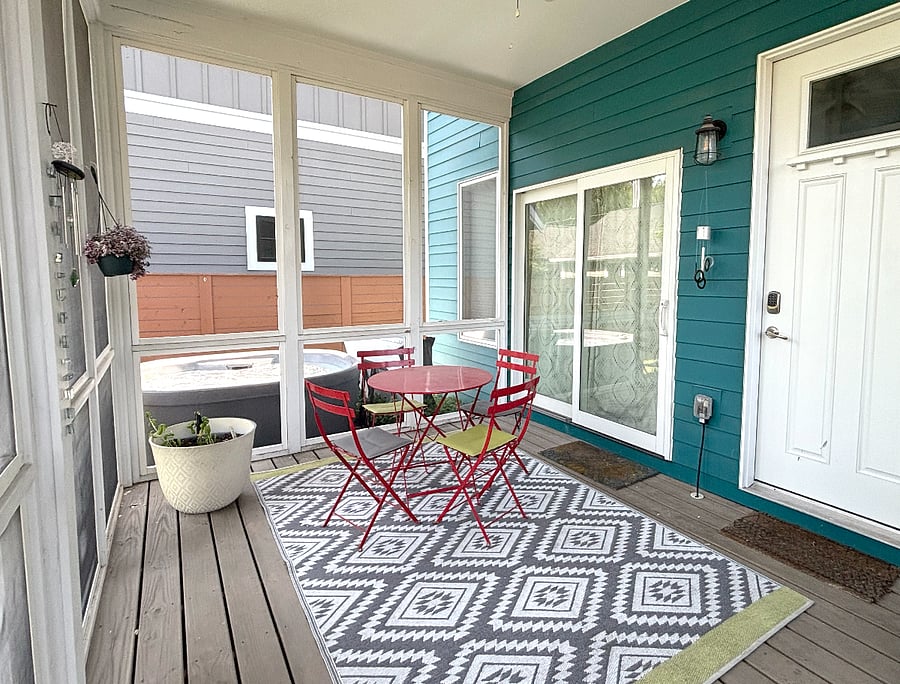 Screened-in porch with ceiling fan for enjoying a bug-free meal or relaxing in 3 out of 4 seasons.