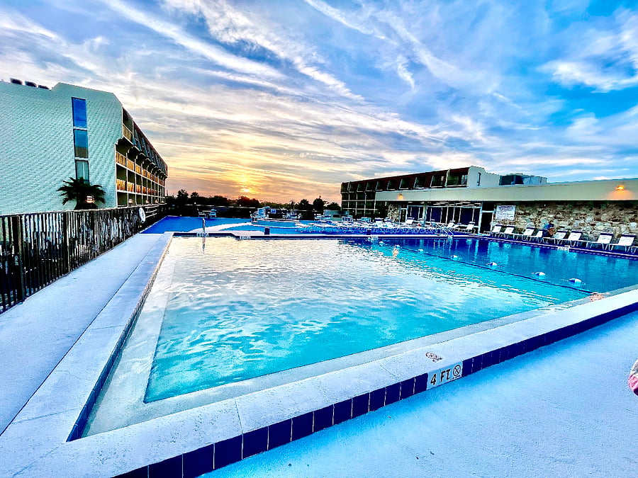 Heated pool with relaxing sunset views and a peaceful evening setting