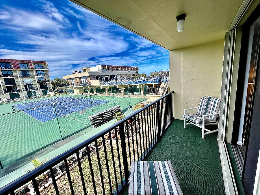 Private balcony with tennis court and pool views