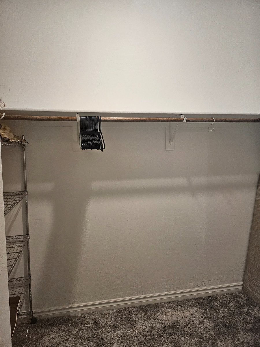 One side of main bedroom walk-in closet