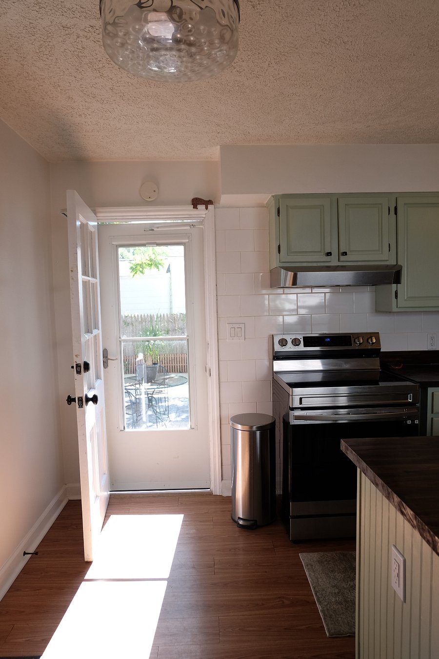 Back door from kitchen to fenced yard