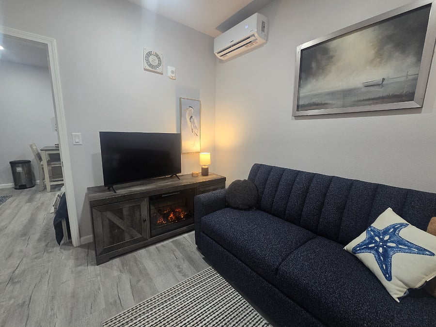 TV stand doubles as "fireplace" and additional storage