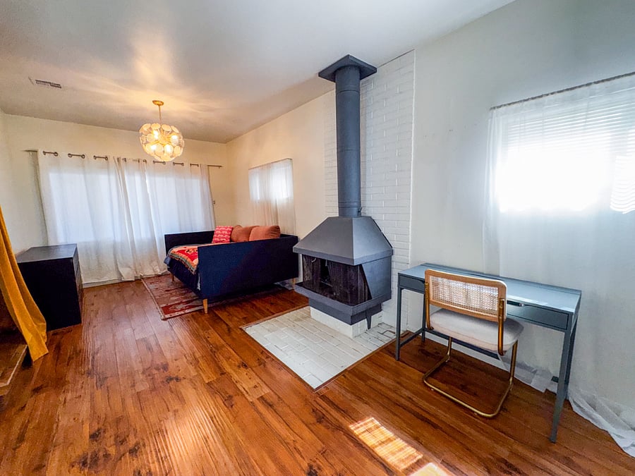 office room with day bed. Fireplace is non functional