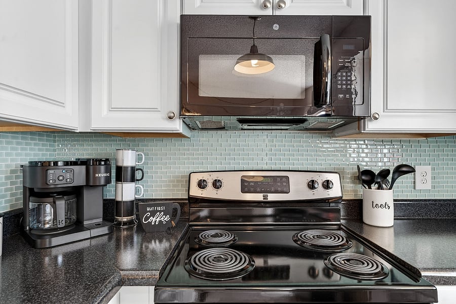 Fully equipped kitchen with breakfast bar and dining area just steps away for easy gatherings. Includes all the essentialsplus a blender for celebratory mixed drinks after a fun day on the golf course.