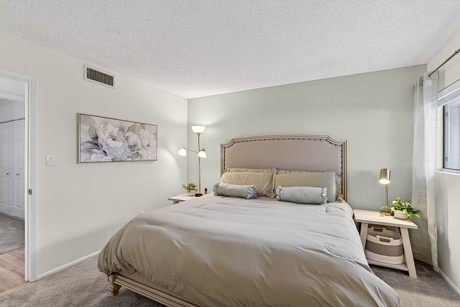 Primary bedroom features a Sleep Number king bed, a private en-suite bathroom, and a TVyour perfect retreat for rest, relaxation, and a little entertainment.