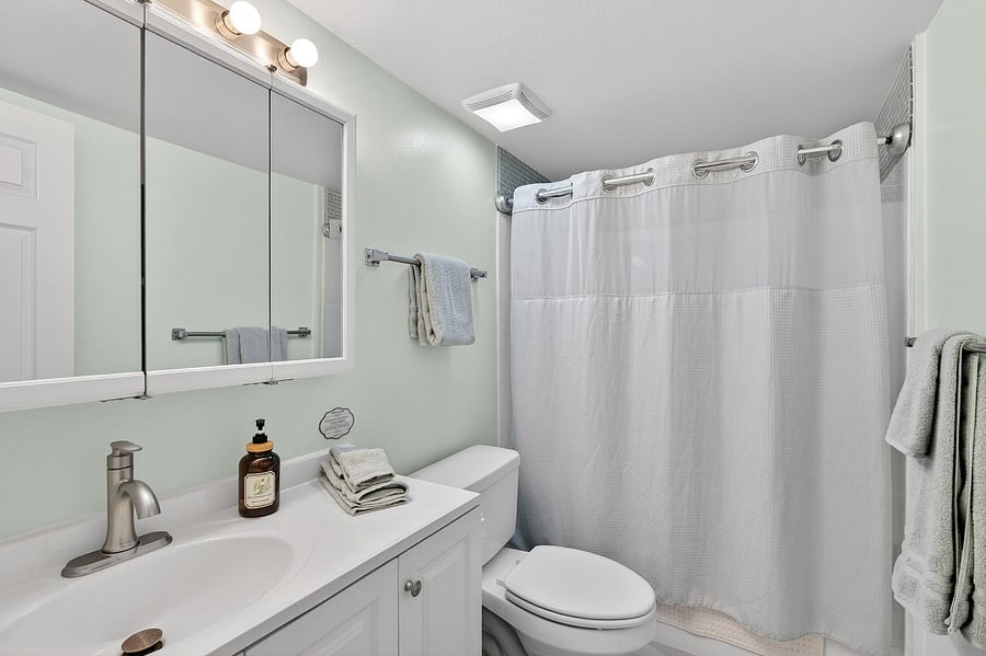 Full bathroom featuring a relaxing bathtub, perfect for unwinding after a day of fun or travel.