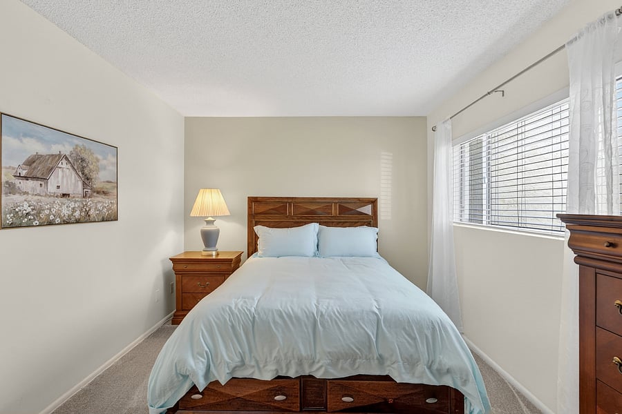 The second bedroom offers a queen bed and Smart TV, plus a twin fold-up roll-away in the closet, flexible sleeping options for family or guests.