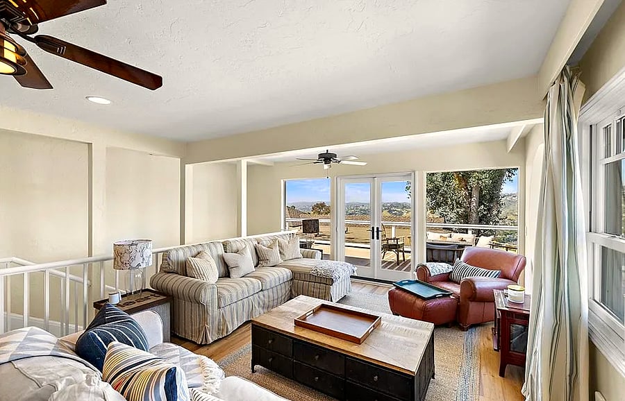 Living room upstairs that opens to the deck