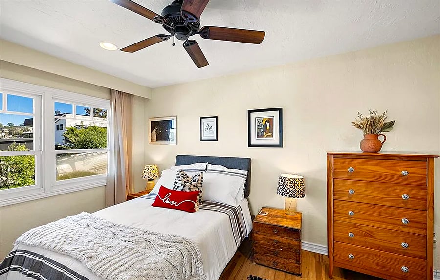 Full size bed and desk in this room