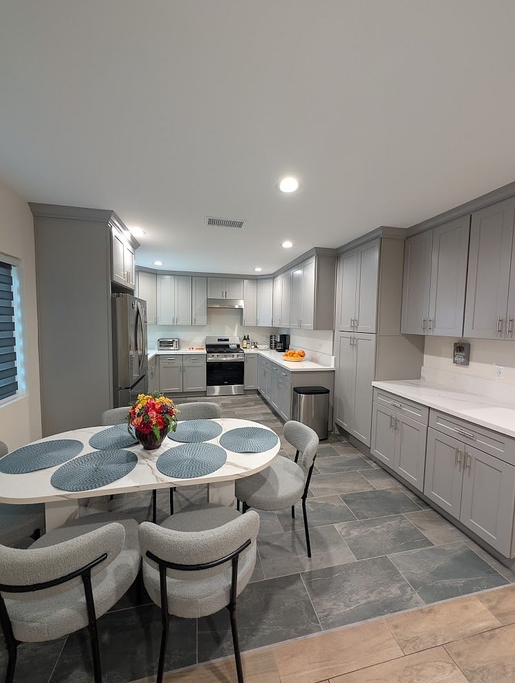 Fully remodeled kitchen with modern finishes and stainless steel appliances