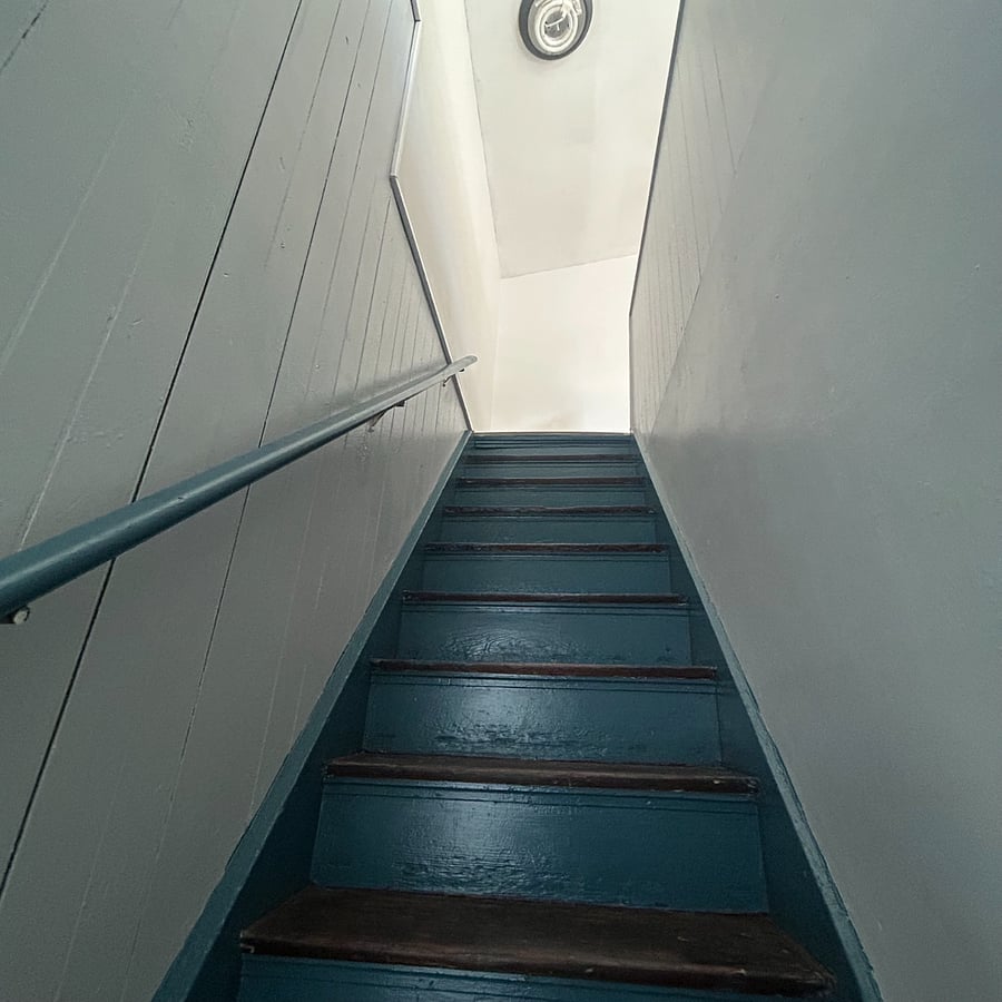 steep staircases leading to the den 